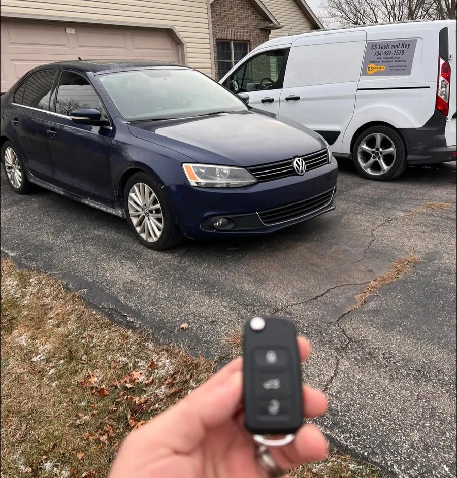 Flip key for a blue Volkswagen Jetta, with the CS Lock and Key van