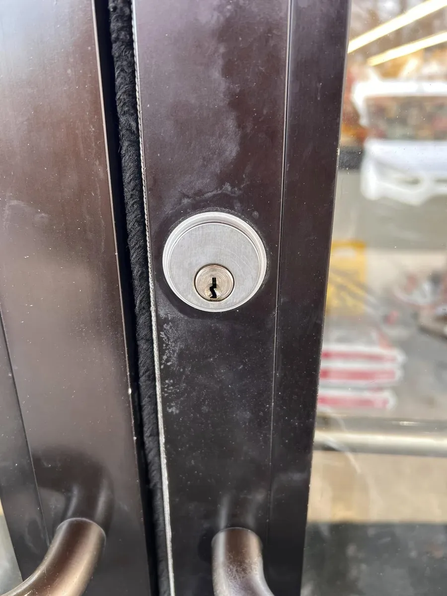 New lock cylinder on a storefront door
