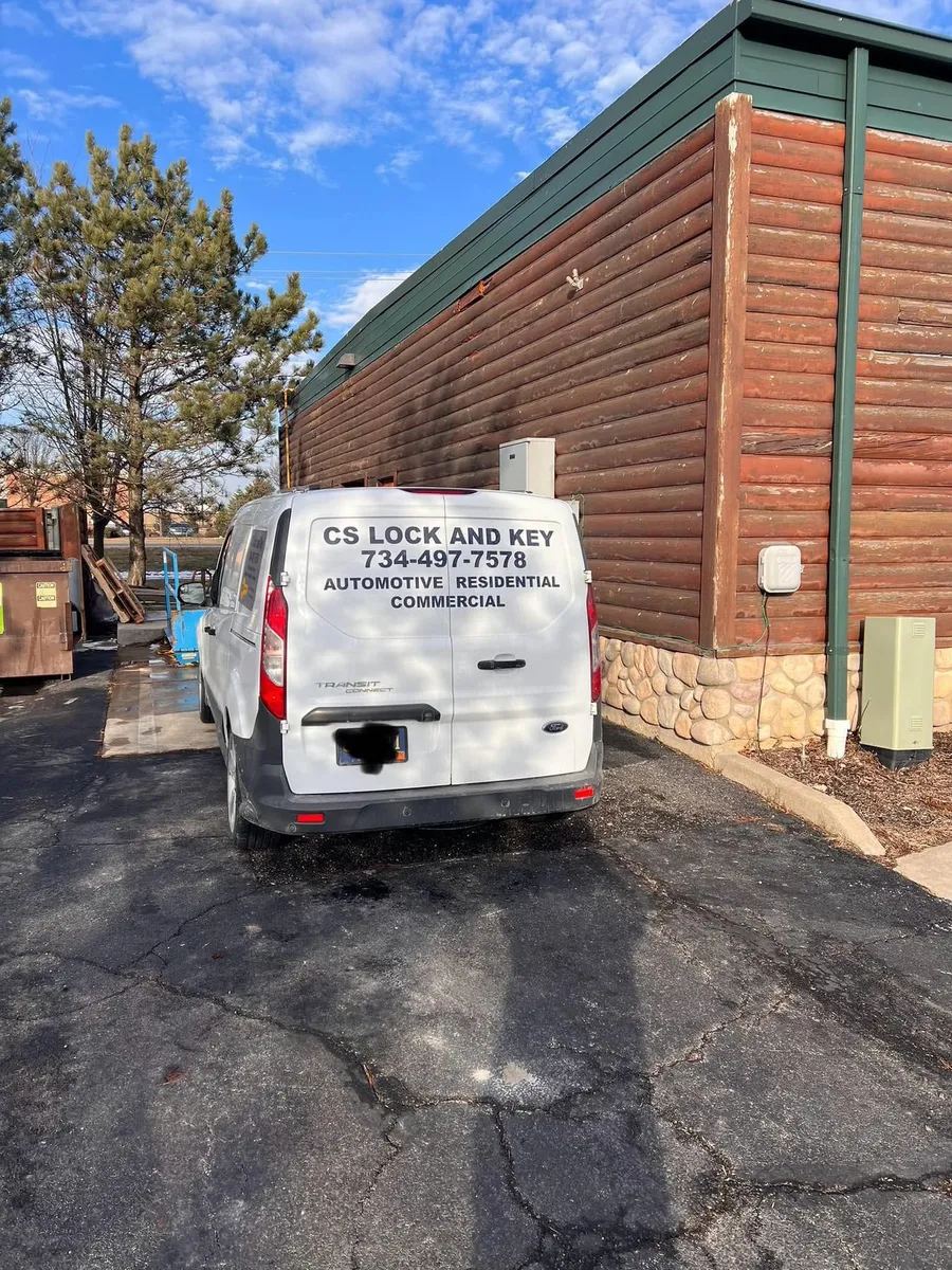 CS Lock and Key van parked at a commercial building