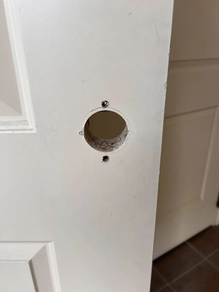 White door bored for a new lock