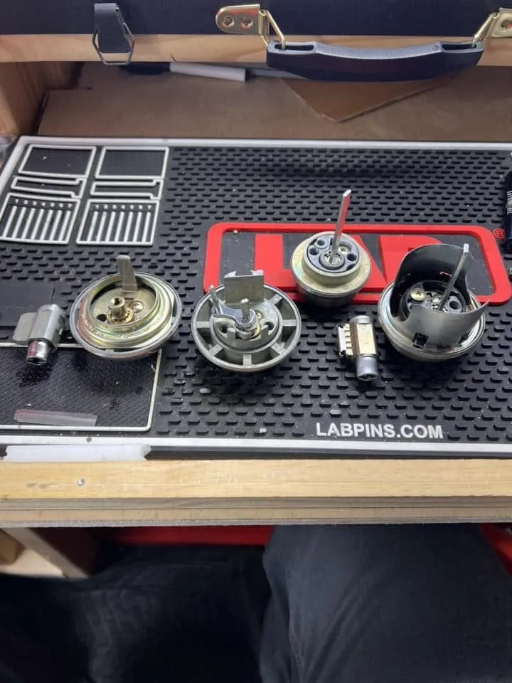 Lock parts laid out on a locksmith work mat