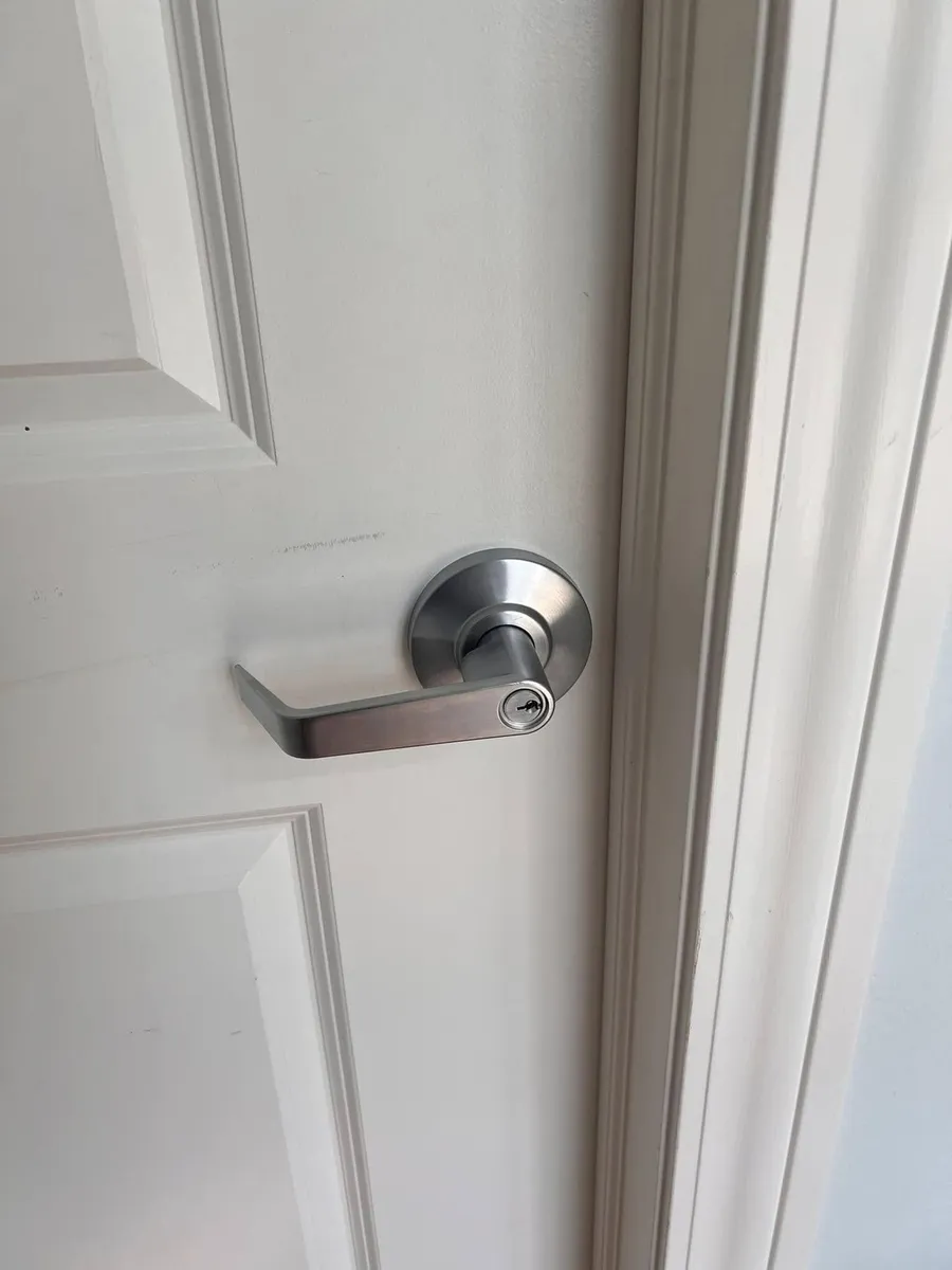 Lever handle on a white door