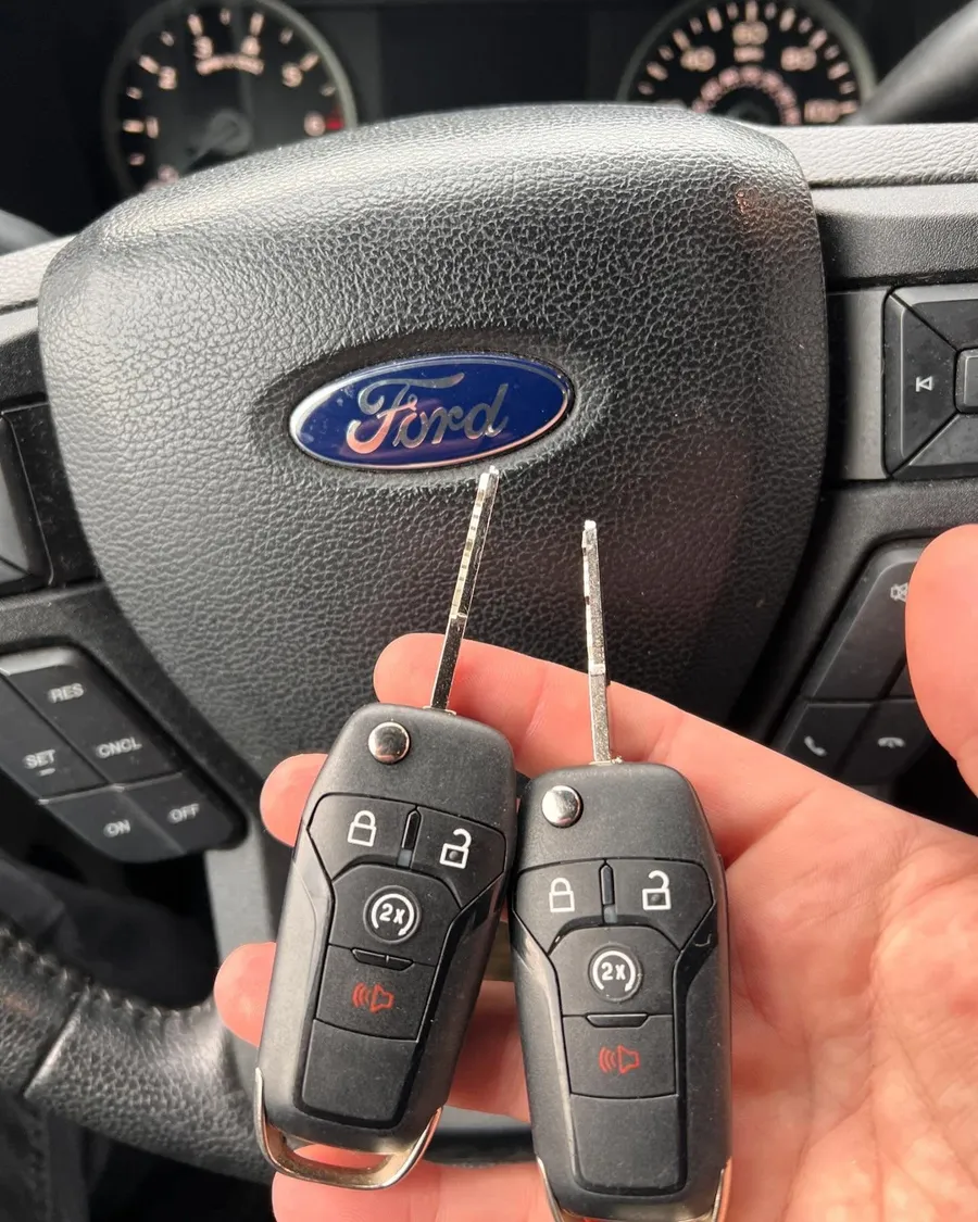 Two Ford flip keys at the steering wheel