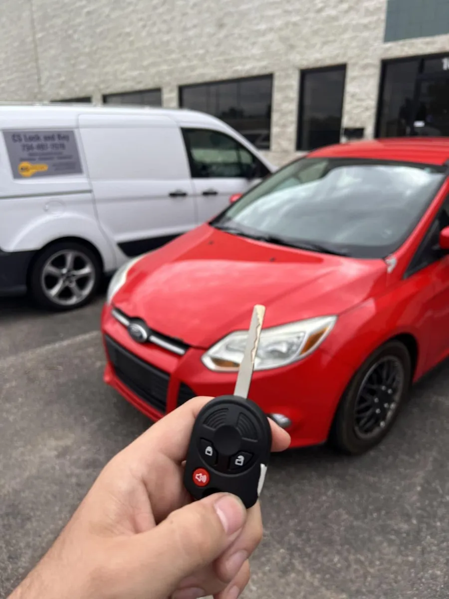 Remote head key for a red Ford Focus, with the CS Lock and Key van