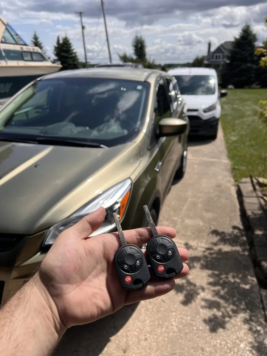 Two keys for a Ford Escape, with the CS Lock and Key van