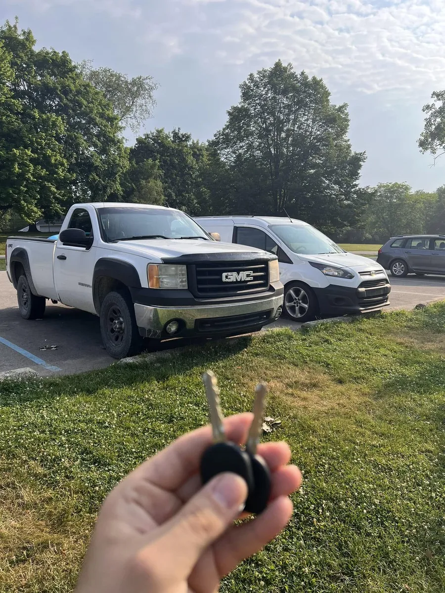Two keys for a white GMC Sierra, with the CS Lock and Key van