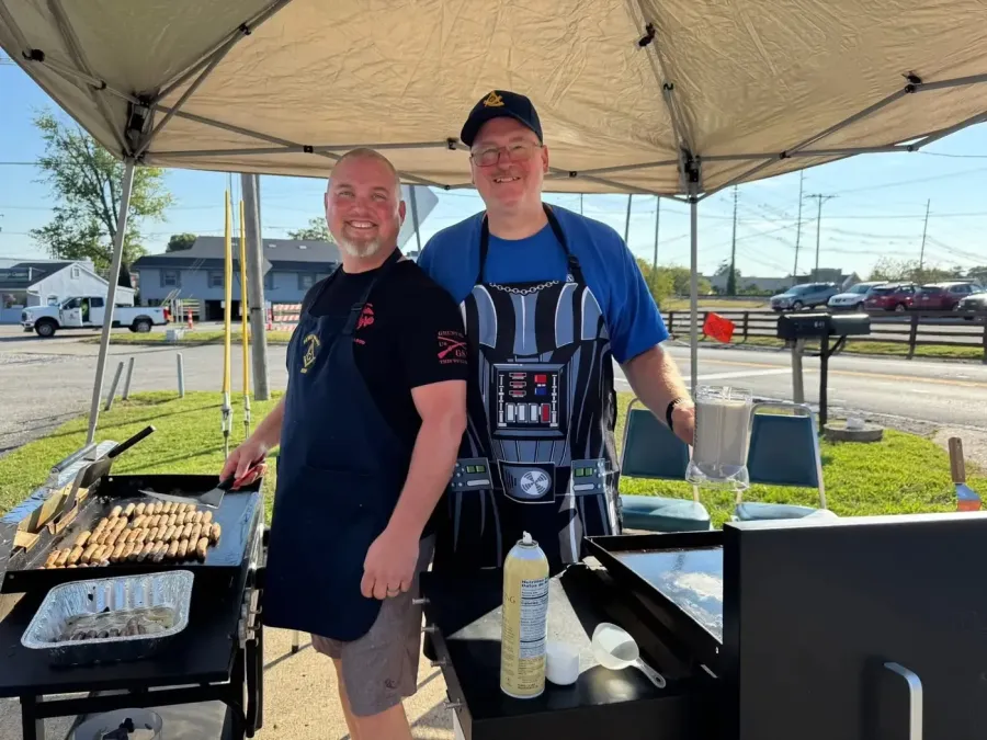 Brothers at the griddle on breakfast morning