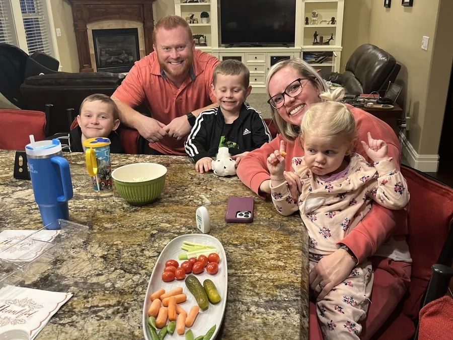 Chris Guymon at home with his wife and kids