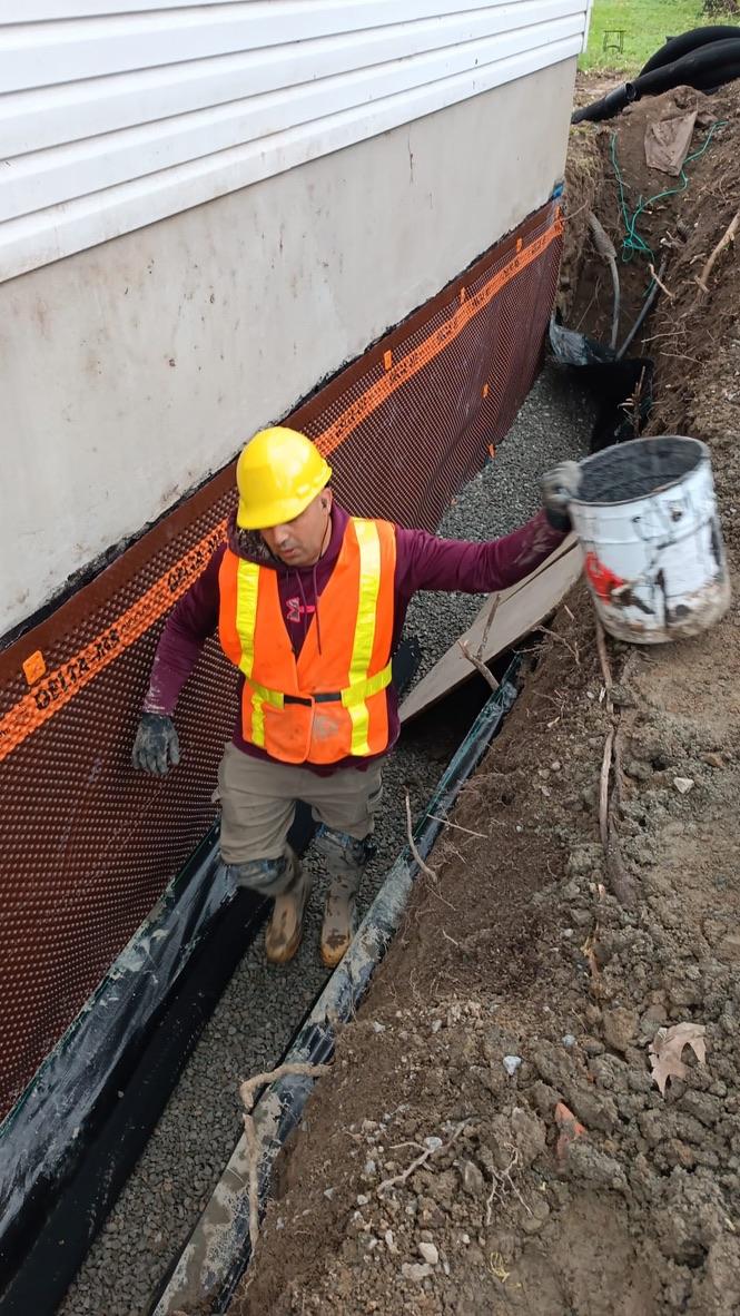 Drainage bed installation — Excavatron job site