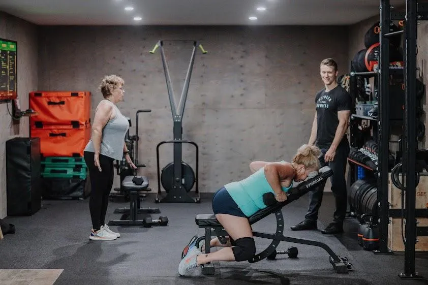 A small group personal training session at Between The Bumpers
