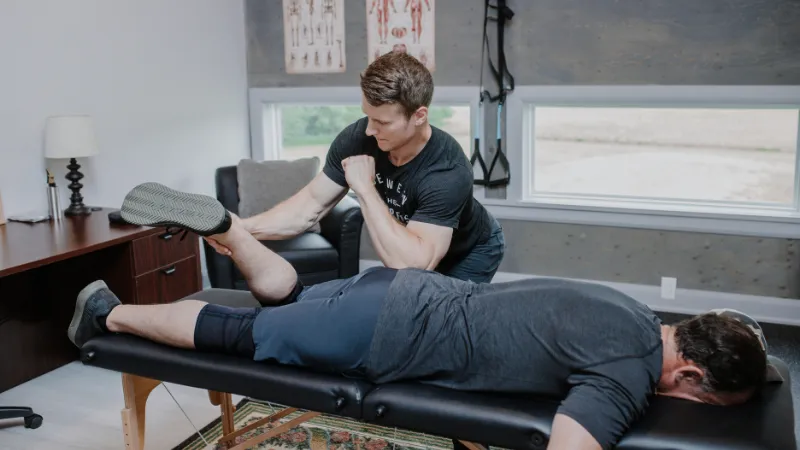 Megan Wallenius, physiotherapist, assessing a client