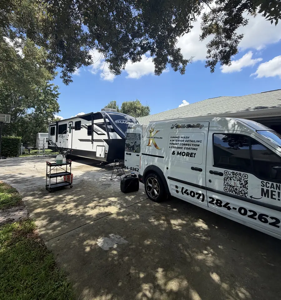 King Luxury Detailing mobile van on site detailing a travel trailer in the Orlando, FL area