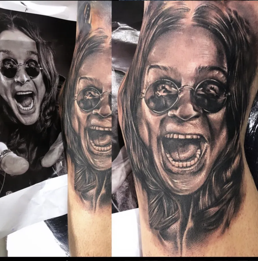 Black and grey realism sleeve tattoo by Felipe Rapucci