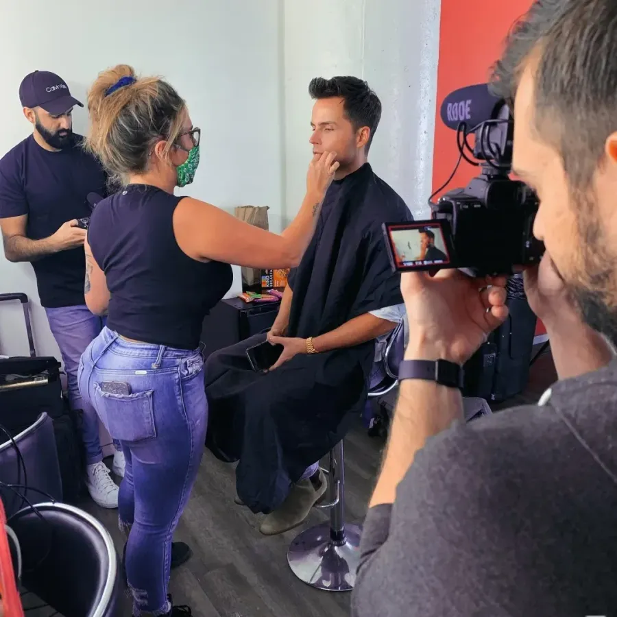 City Lights artists grooming talent on set while the camera crew sets up the shot