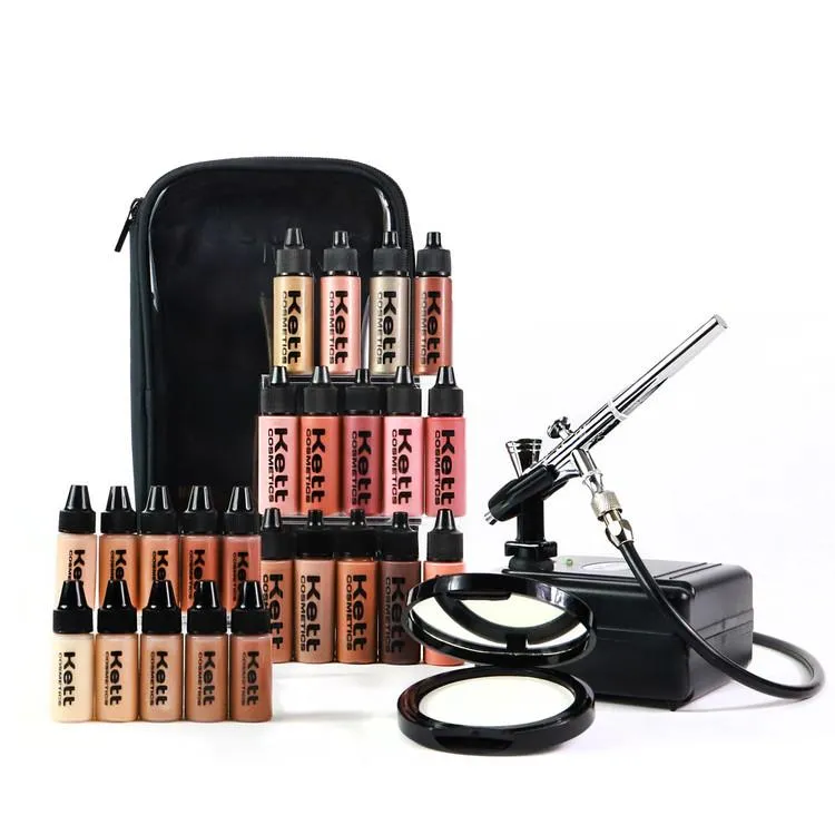 Professional airbrush compressor with a row of foundation bottles in the kit