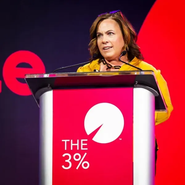Speaker at the podium at The 3% Conference