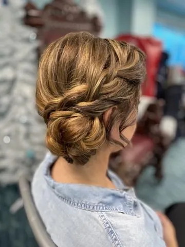Soft twisted updo finished for a formal event