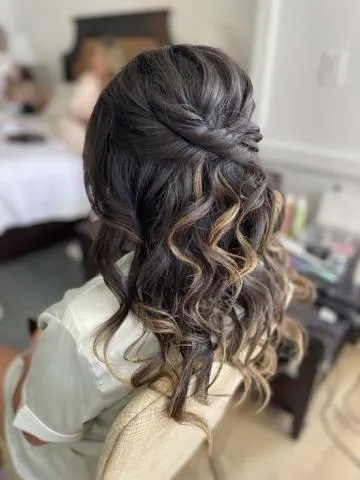 Textured low bun with face-framing pieces for an evening event