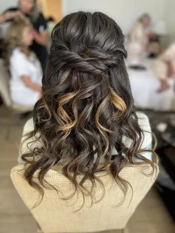 Loose chignon with volume through the crown