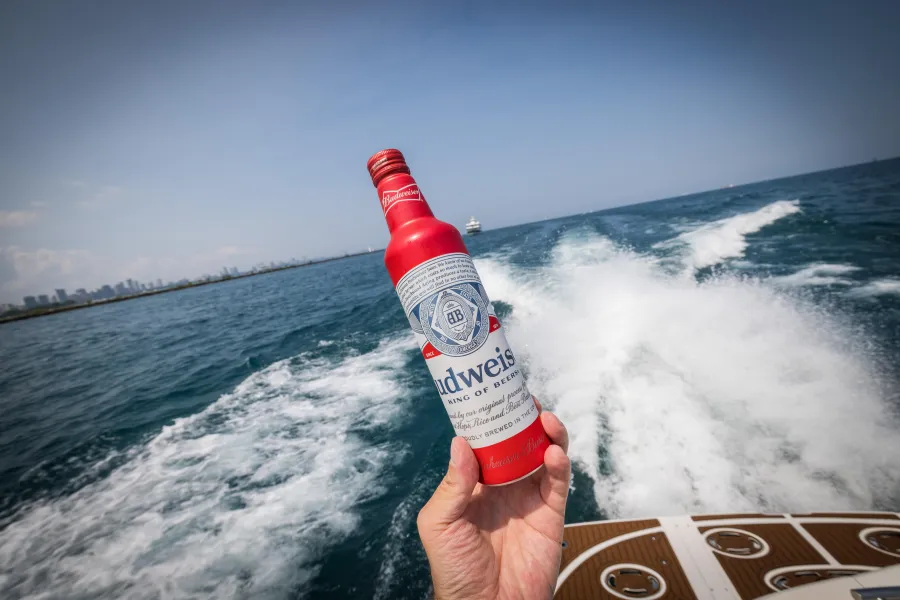 Budweiser bottle held up on the water during the Chicago lake activation