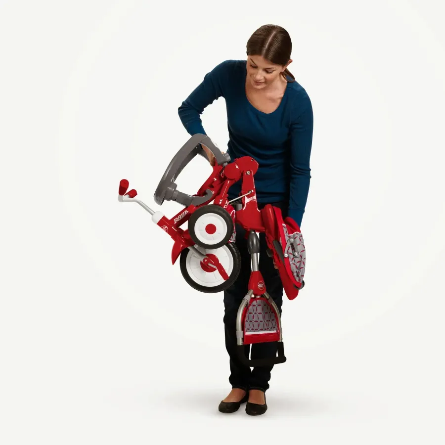 Parent folding a Radio Flyer trike in a product demonstration shot