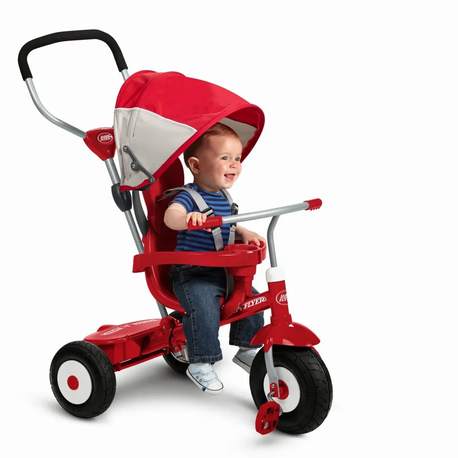 Toddler riding a red Radio Flyer trike for product photography