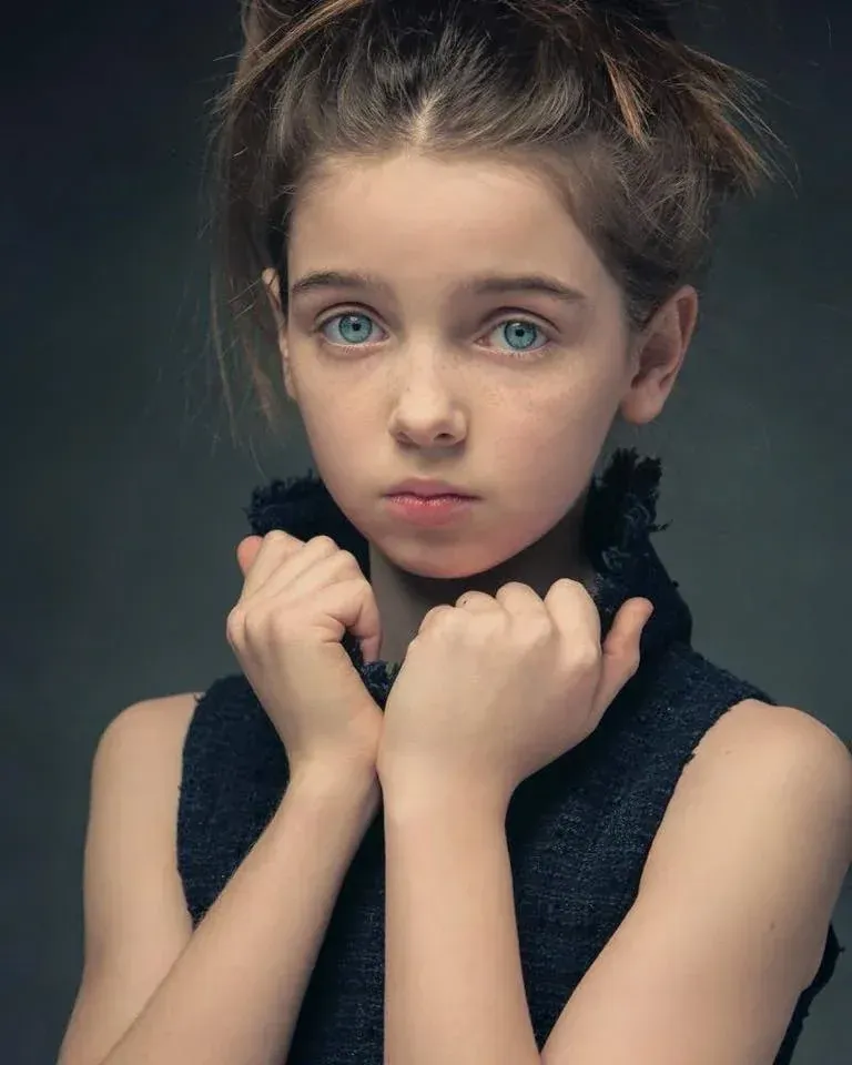 Dramatic child model headshot with natural styling