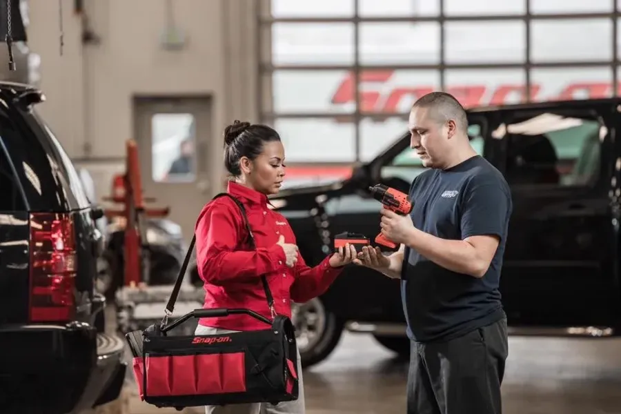 Snap-on brand campaign: technician and customer beside a tool truck
