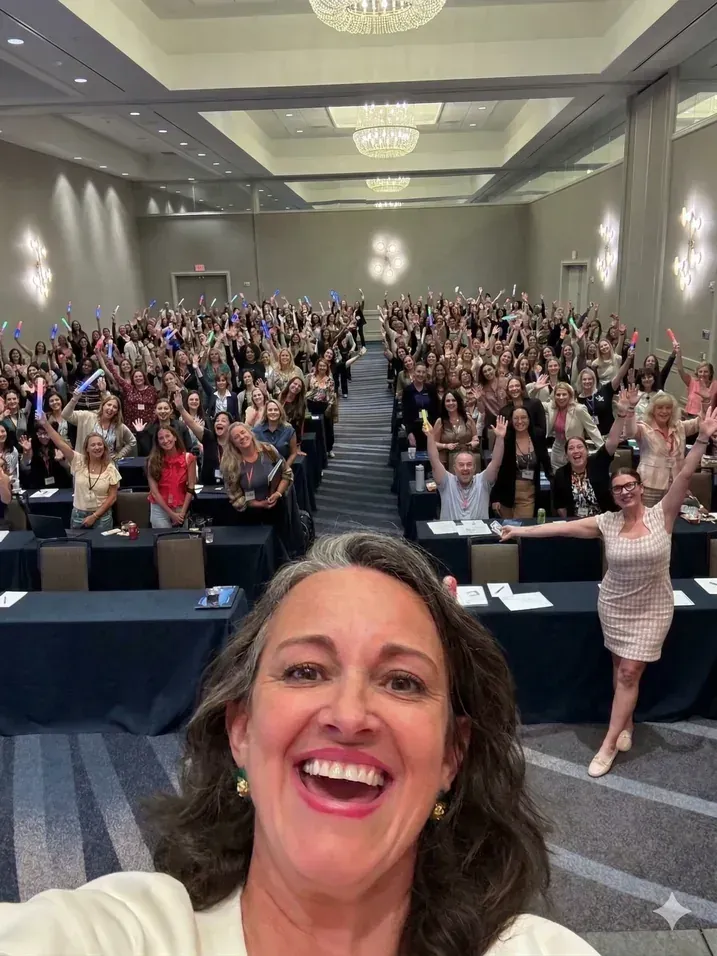 Packed ballroom of attendees cheering at the AmeriLife Summit