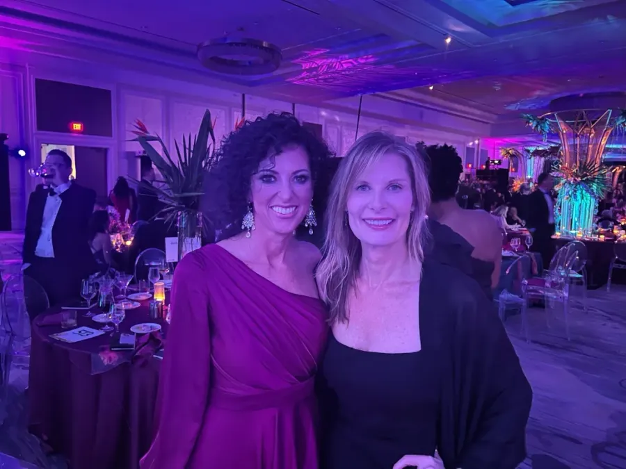 Guests at a black-tie gala with hair and makeup by City Lights Beauty Agency