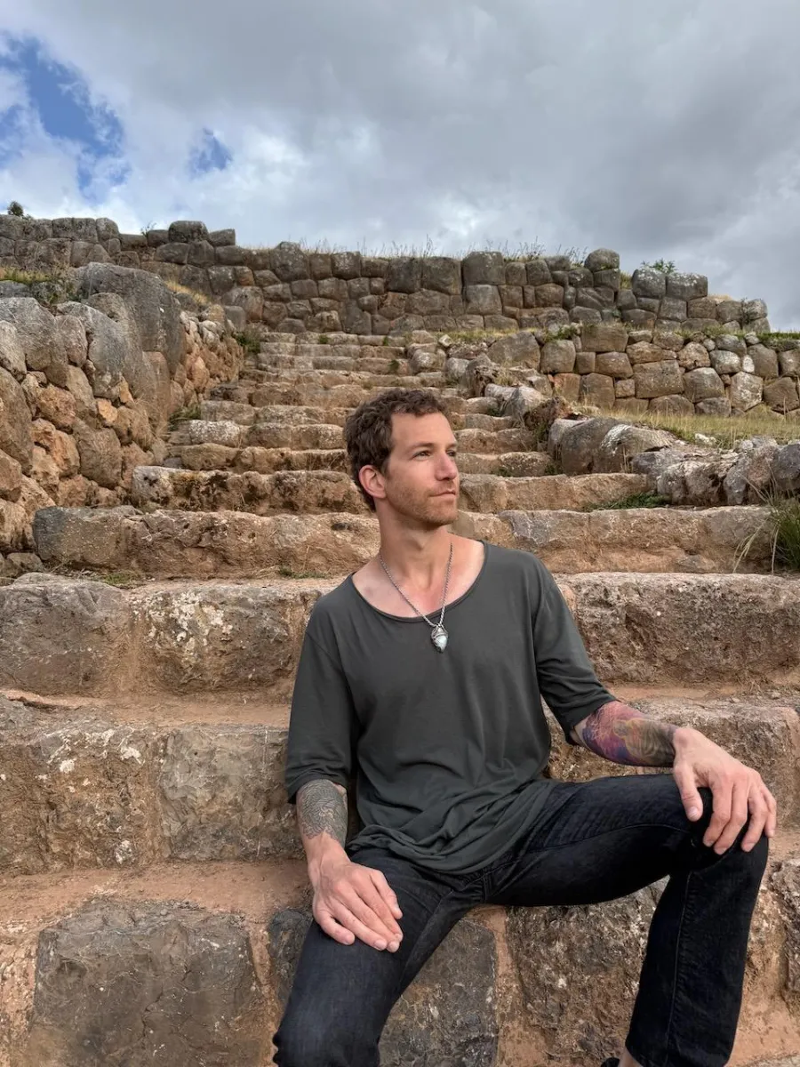 Daniel sitting on ancient stone steps
