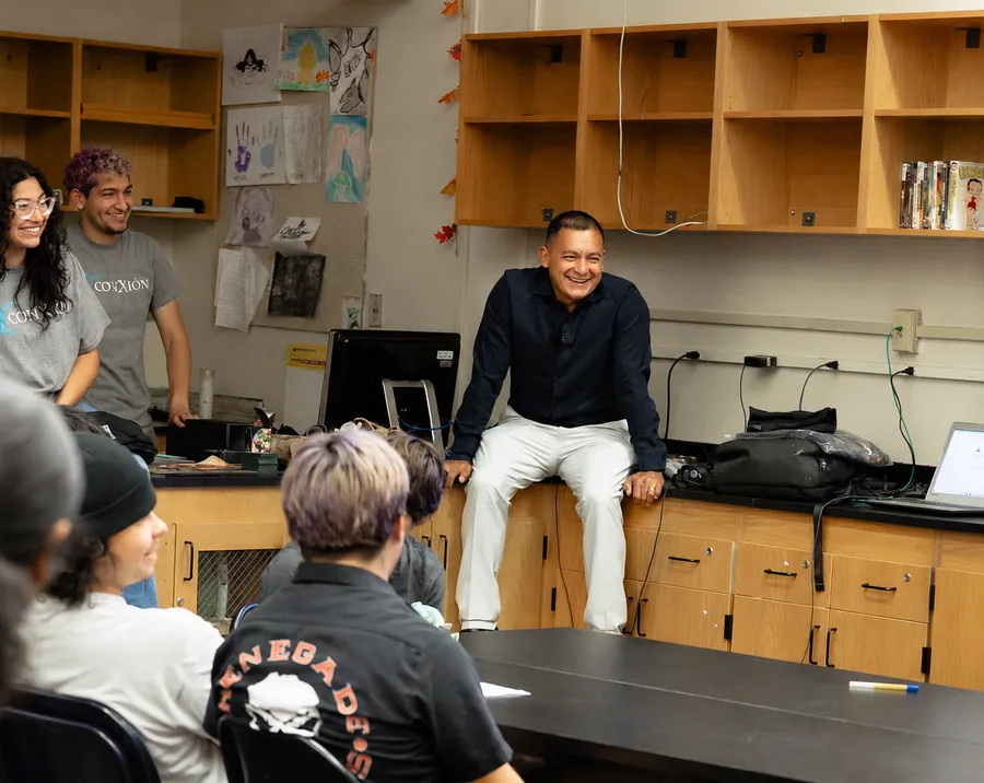 Jose speaking with students