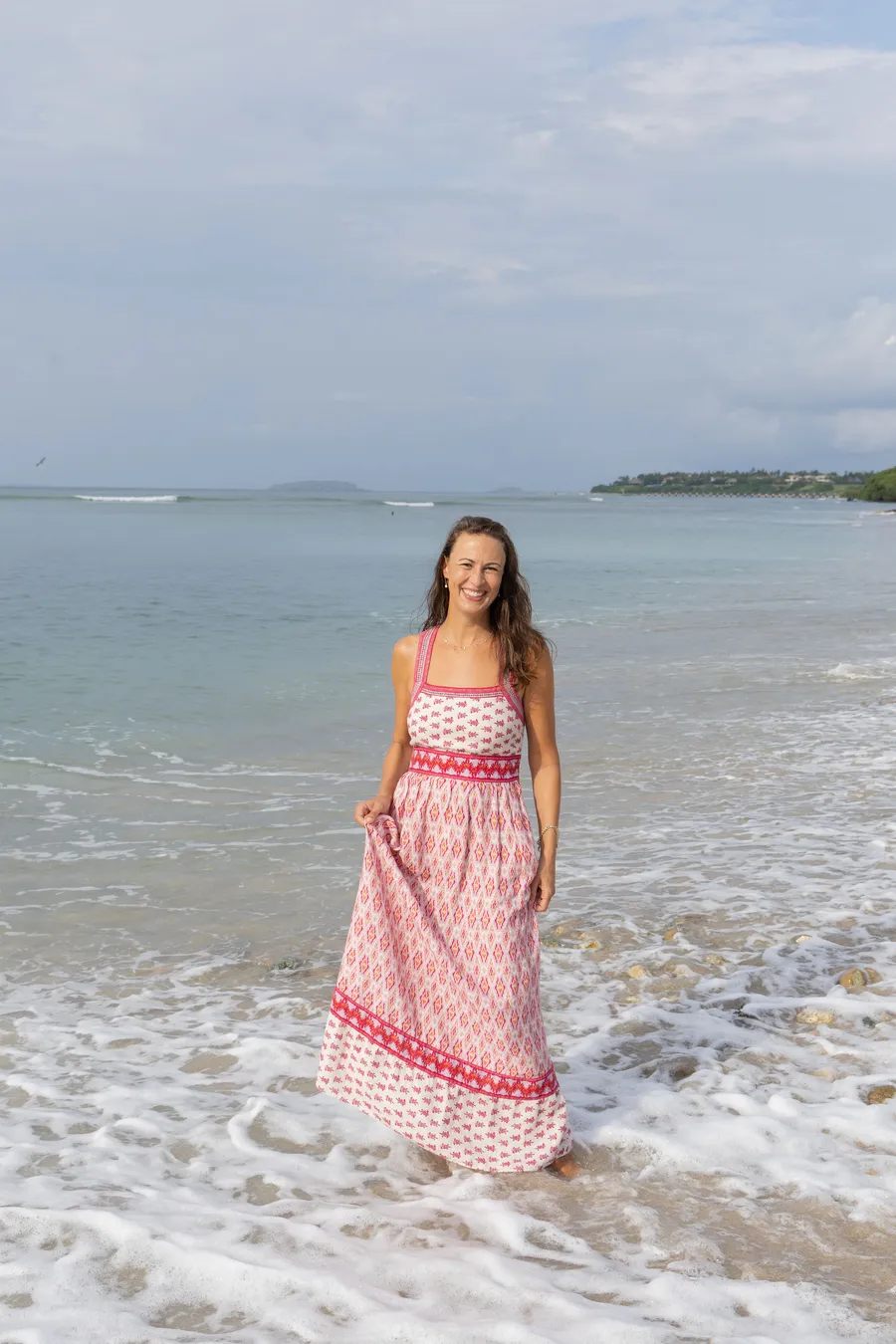 Elena smiling in the ocean waves