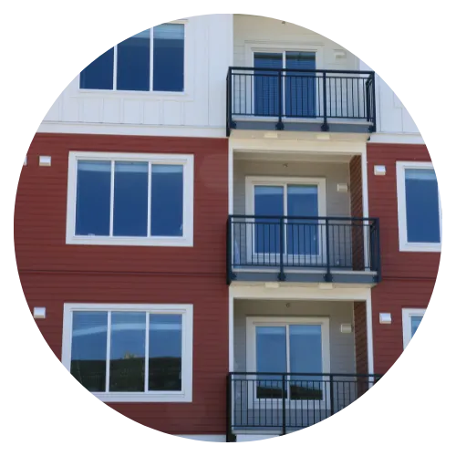 A brick apartment building with balconies