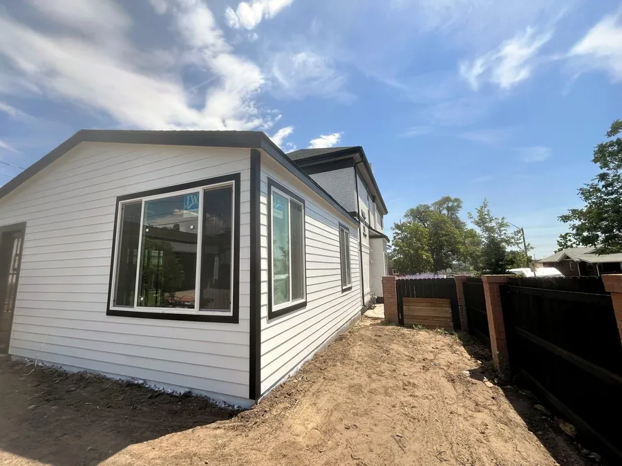 Exterior siding painted white with black window trim, Denver