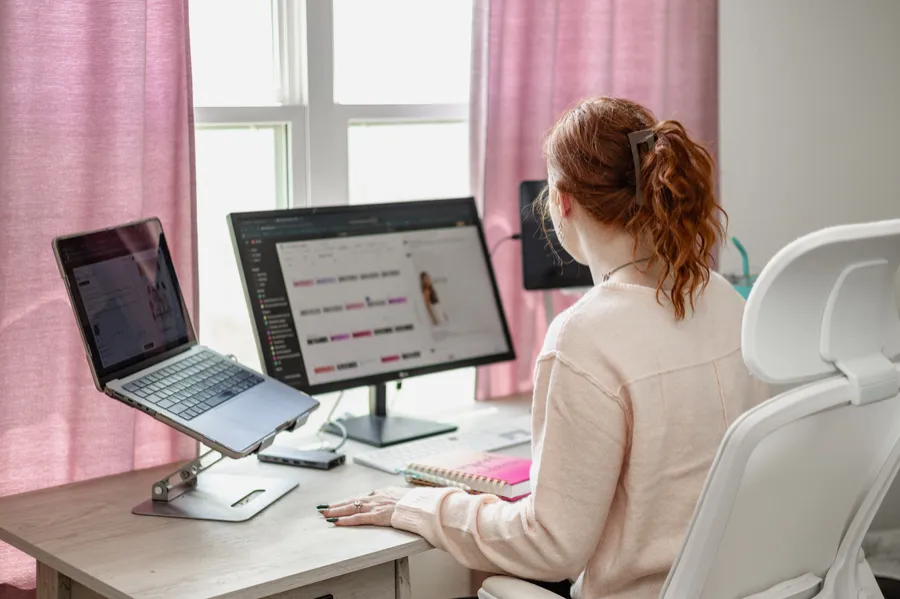 Nikki working on client content at her desk