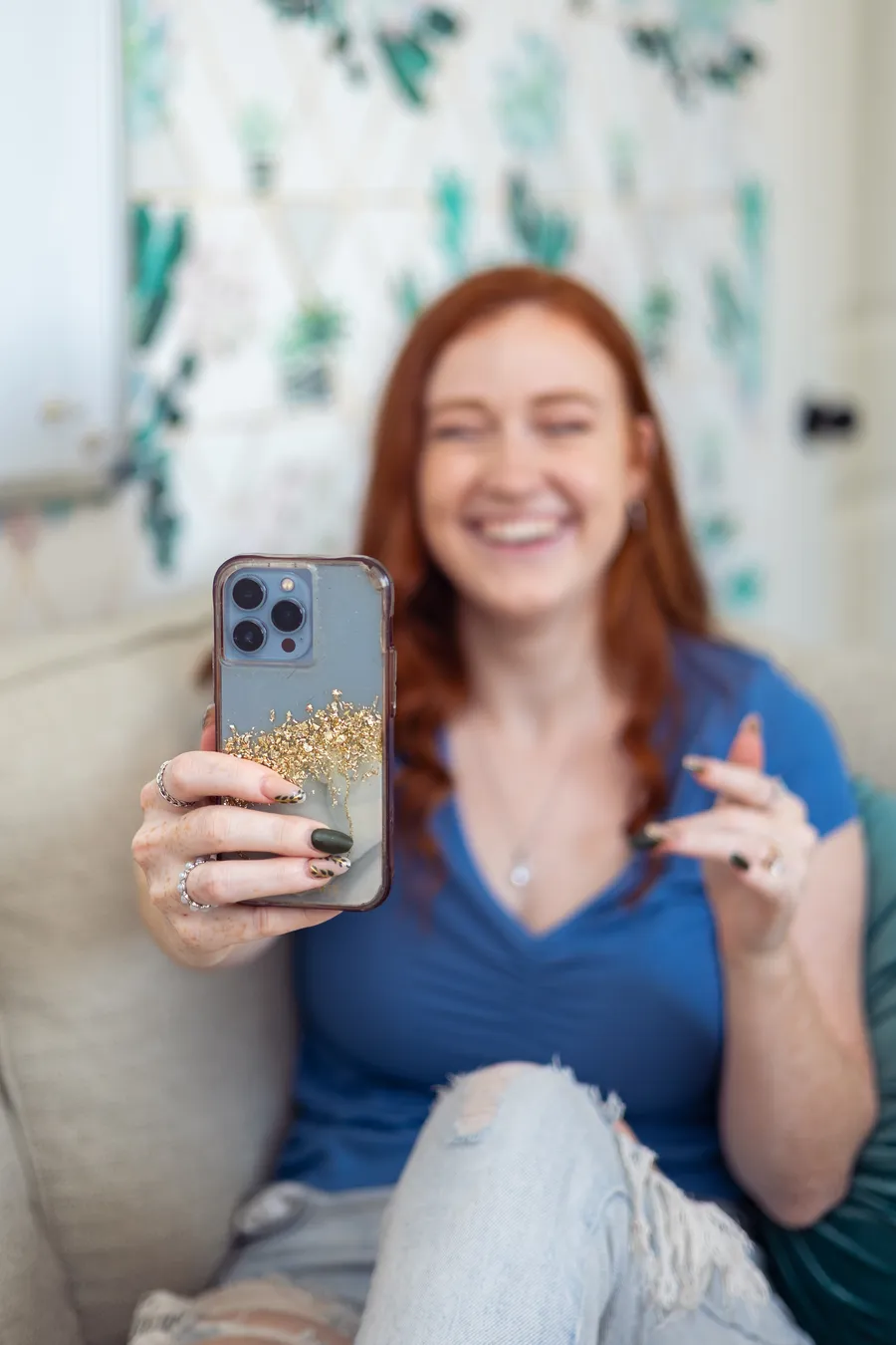 Nikki filming content on her phone