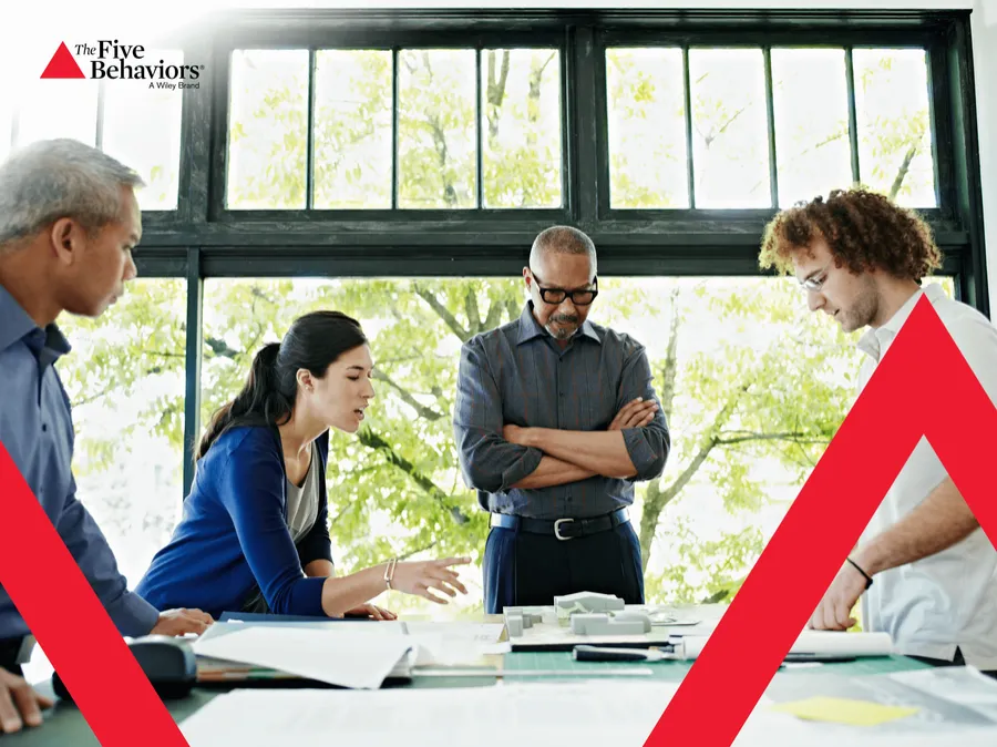 A leadership team working over plans. Photo: The Five Behaviors®