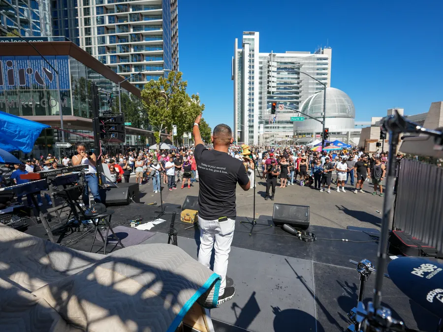 Jose speaking at an outdoor event
