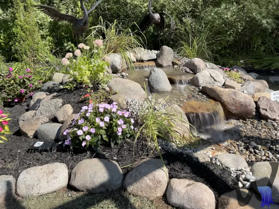 Well kept garden stream with clear water