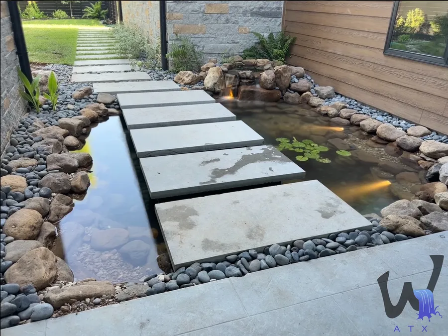 Stepping stones crossing a koi pond