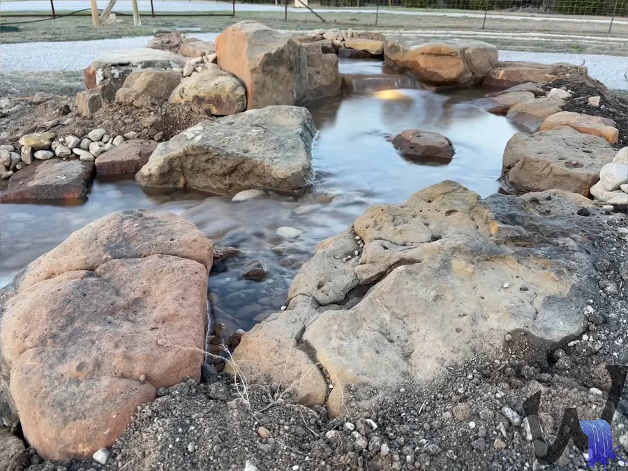 Pondless stream with natural stone edges