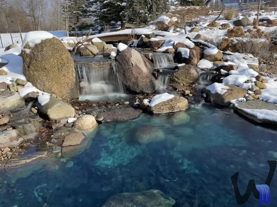 Clean pond with a waterfall after service