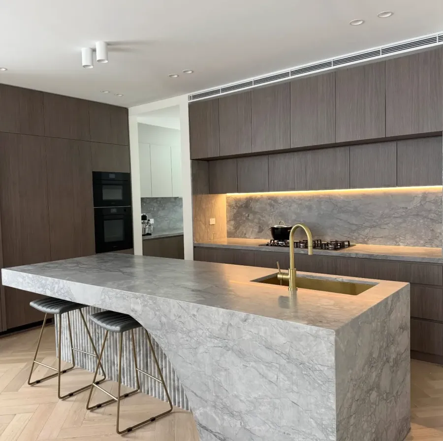 Brown kitchen cabinet with marble kitchen island