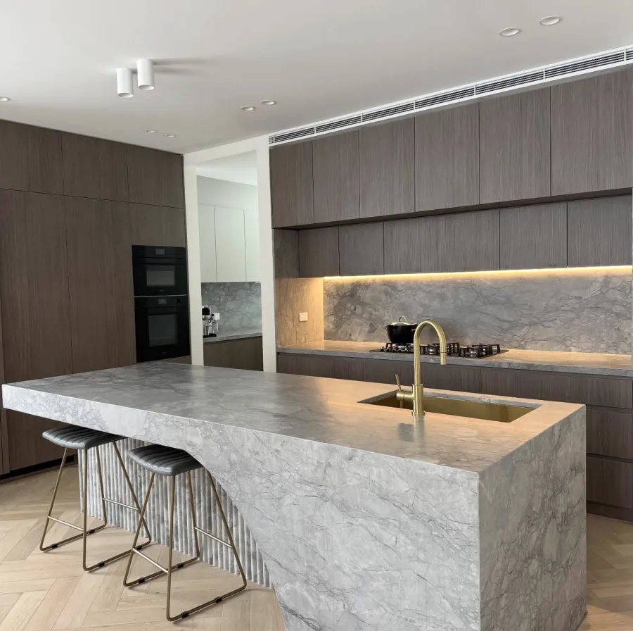 Modern kitchen with marble island protected from damage
