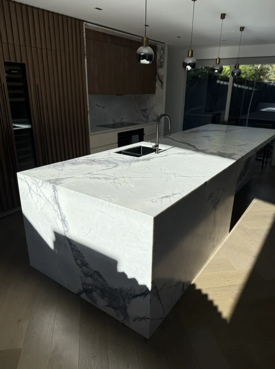White marble kitchen benchtop with crystal-clear protection film applied