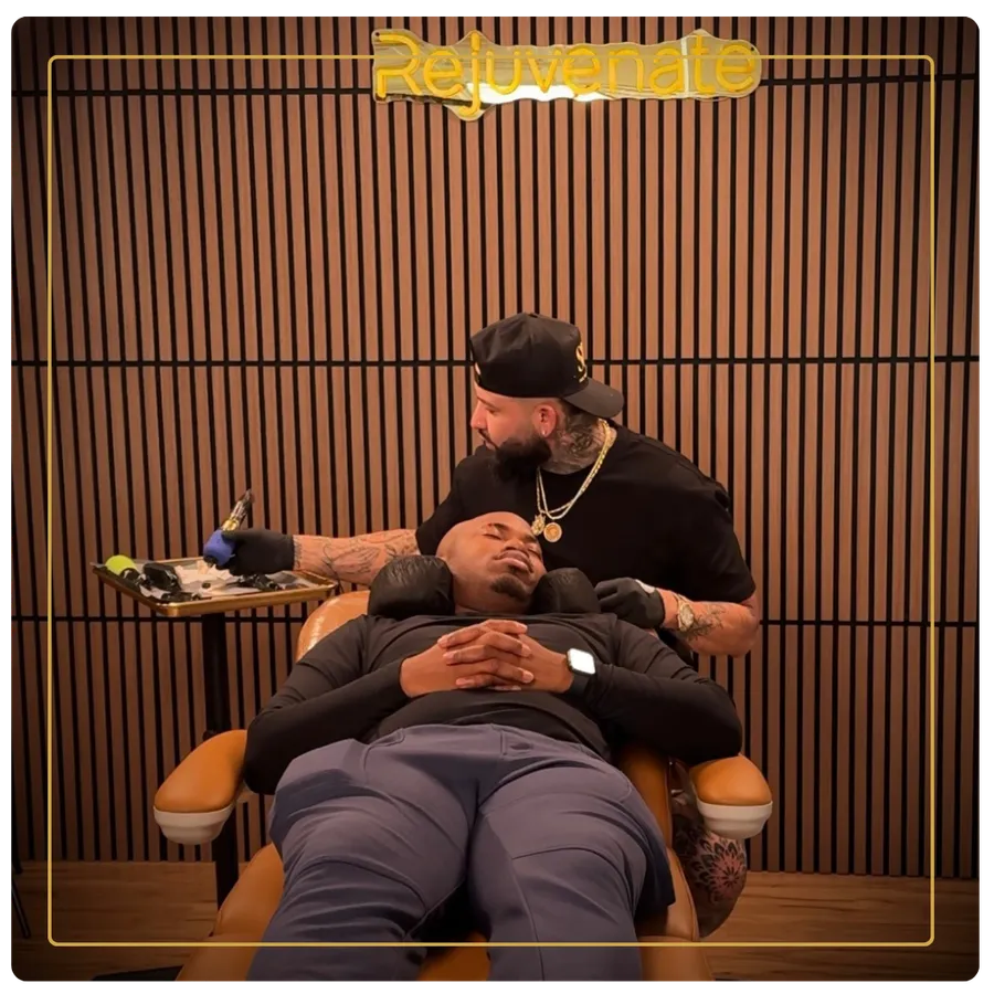 Huber Najera doing scalp micropigmentation on a client at Rejuvenate SMP