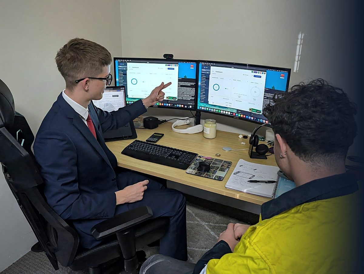 Jack, JDApex founder, walking a Perth trade client through their dashboard