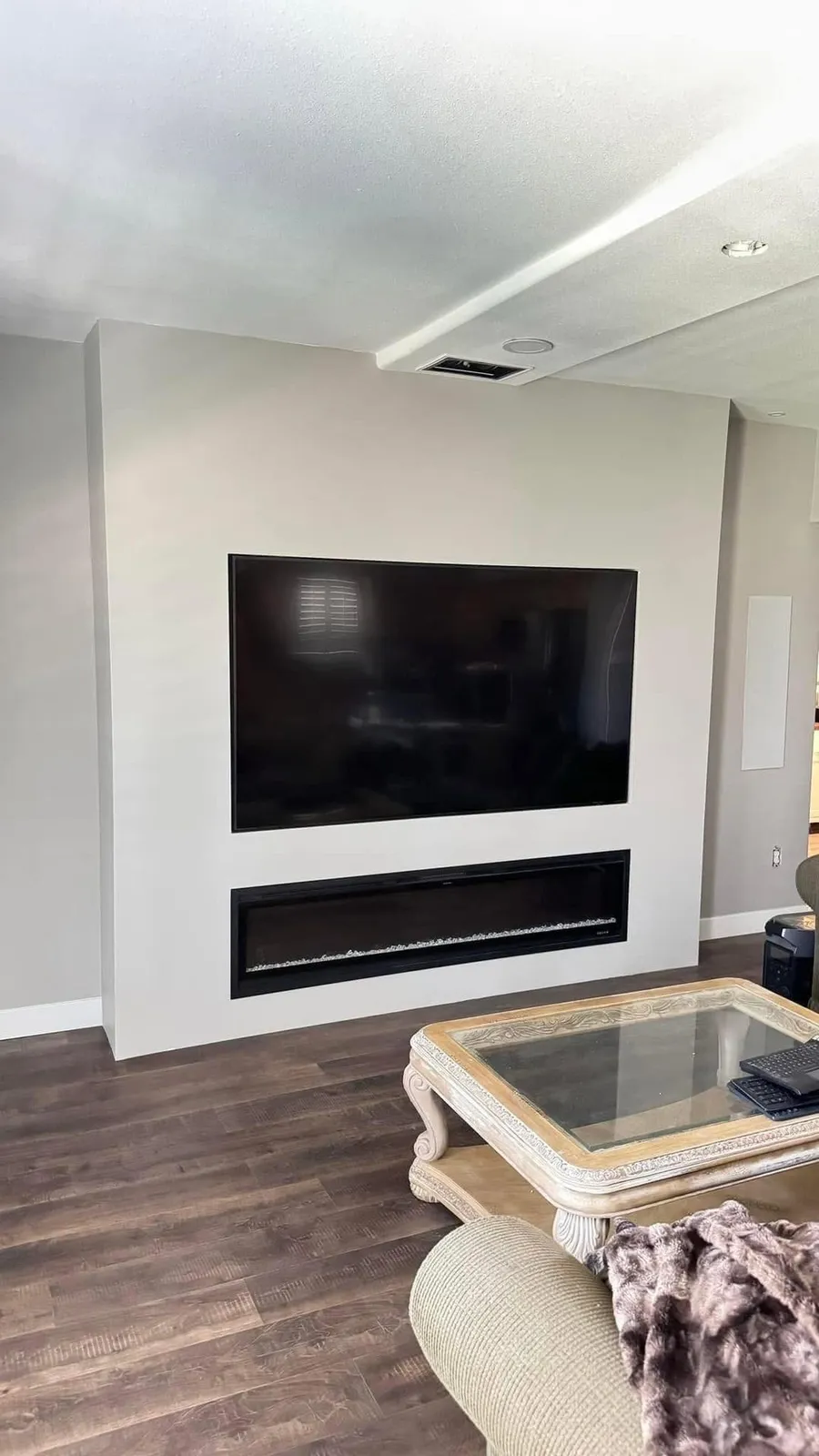 Smooth finished TV and fireplace wall