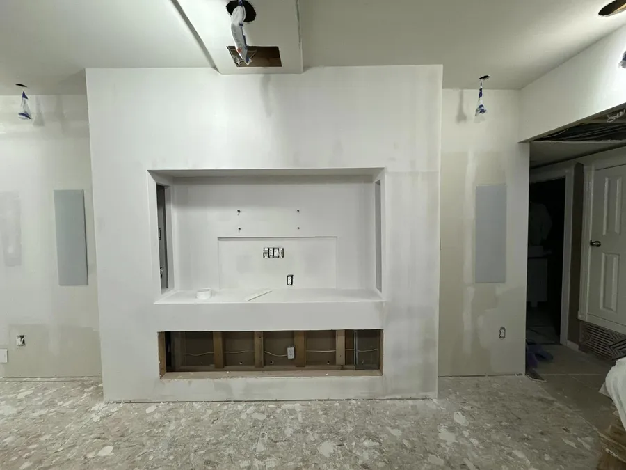 TV and fireplace wall built and finished in drywall